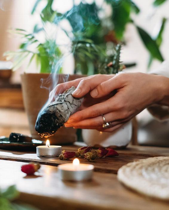 hands burning white safe over candle