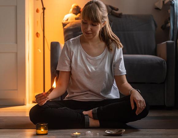 lady meditating in home
